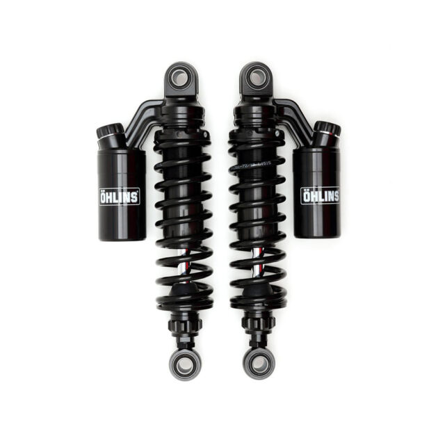 A pair of black shock absorbers on top of each other.