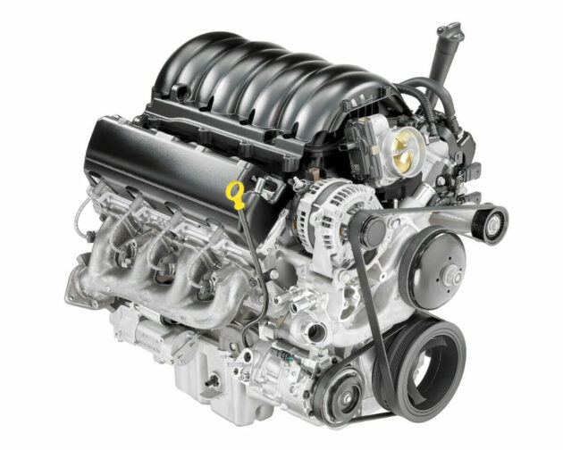 A car engine with the valve cover open.